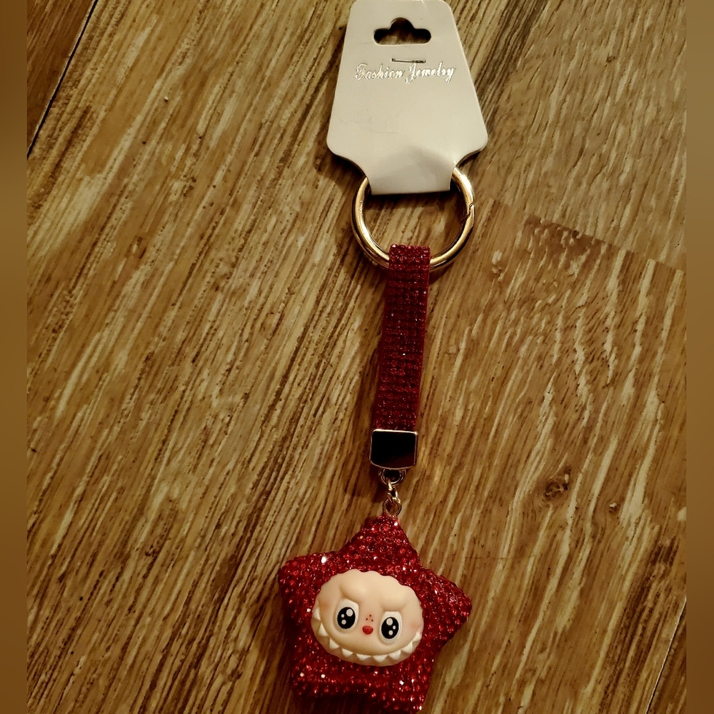 Sparkling Red Star Keychain by [Brand]
